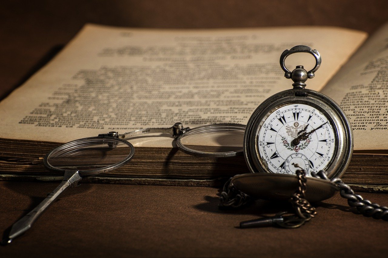 This picture represents the time it takes to learn something new. It is a
picture of an open book with an old clock.