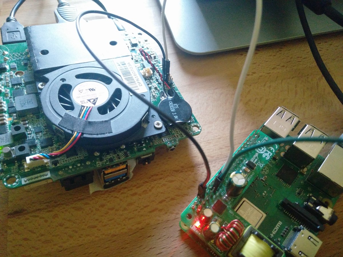 A picture of a Raspberry PI cabled to a Intel NUC board to control the power
lifectycle